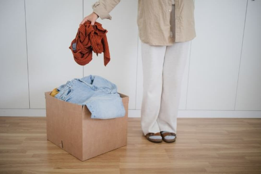 decluttering clothes at home as part of the LET IT GO online program